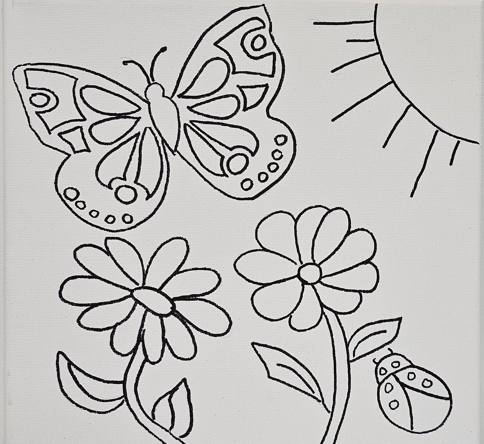 Flat view of butterfly canvas with flowers, sun, and ladybug