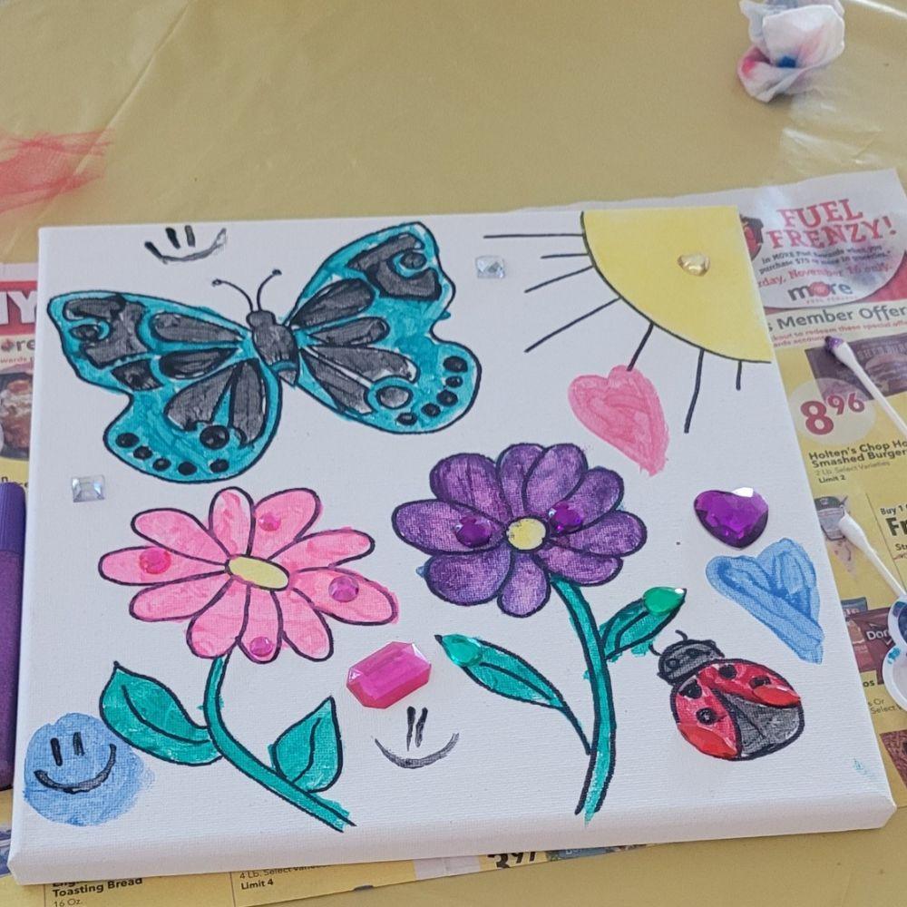 Finished version of the butterfly Creative You canvas with collage and paint details