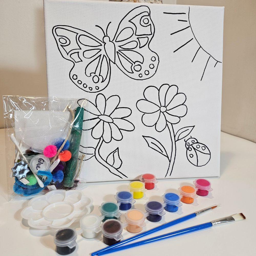 Full Creative You kit with butterfly canvas, collage items, and paints displayed
