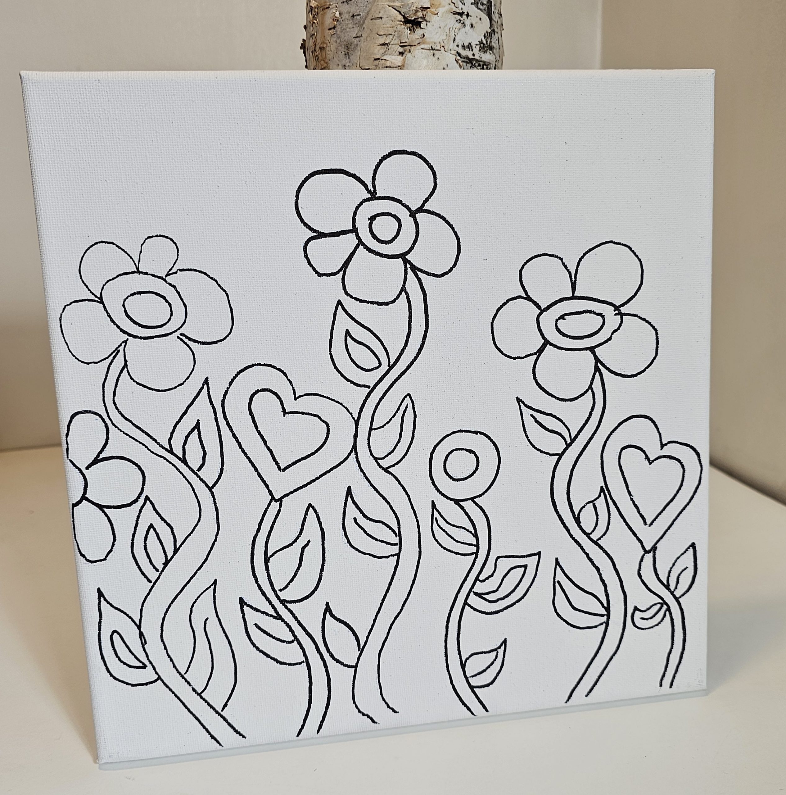 Dancing Blooms canvas leaning upright against a soft background