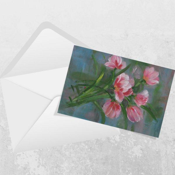 Landscape greeting card featuring red and pink tulips with a premium envelope on a white background.