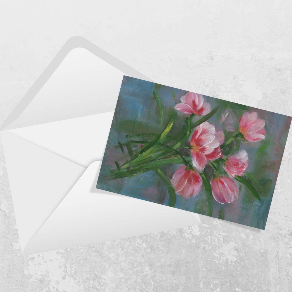 Landscape greeting card featuring red and pink tulips with a premium envelope on a white background.