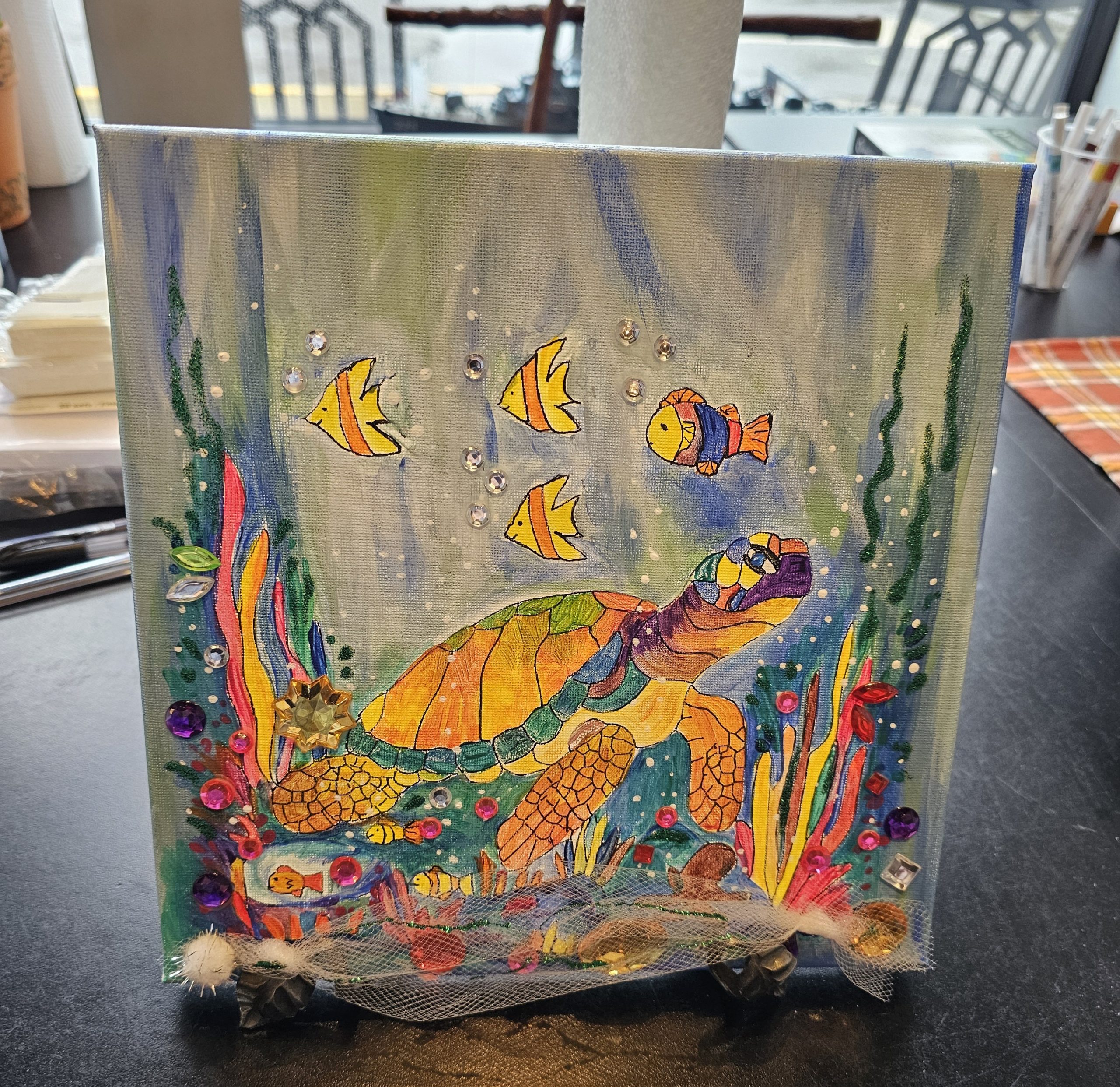 Finished painting of the Creative You Turtle Canvas with paint and collage details