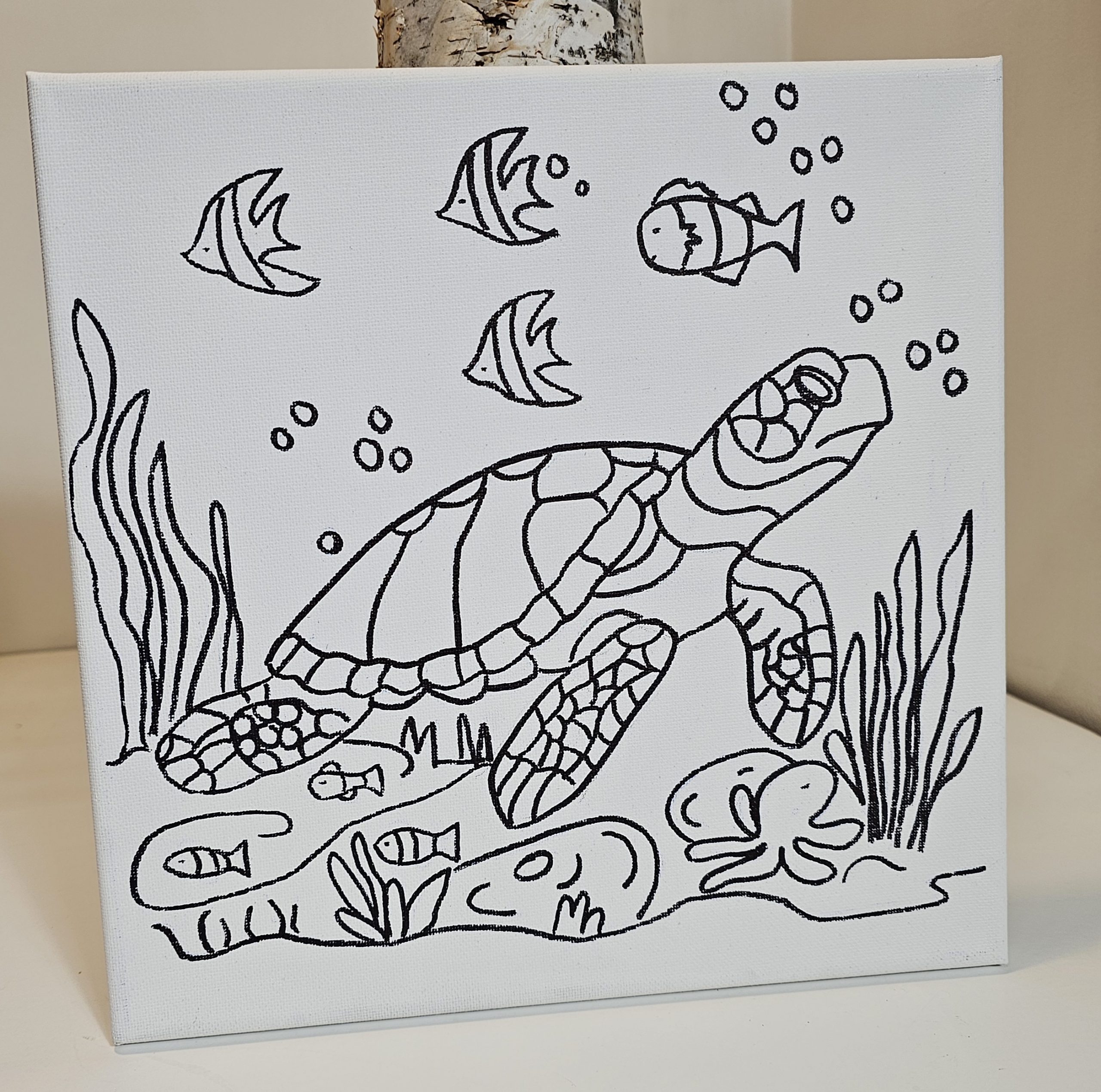 Turtle canvas leaning with soft ocean-themed backdrop