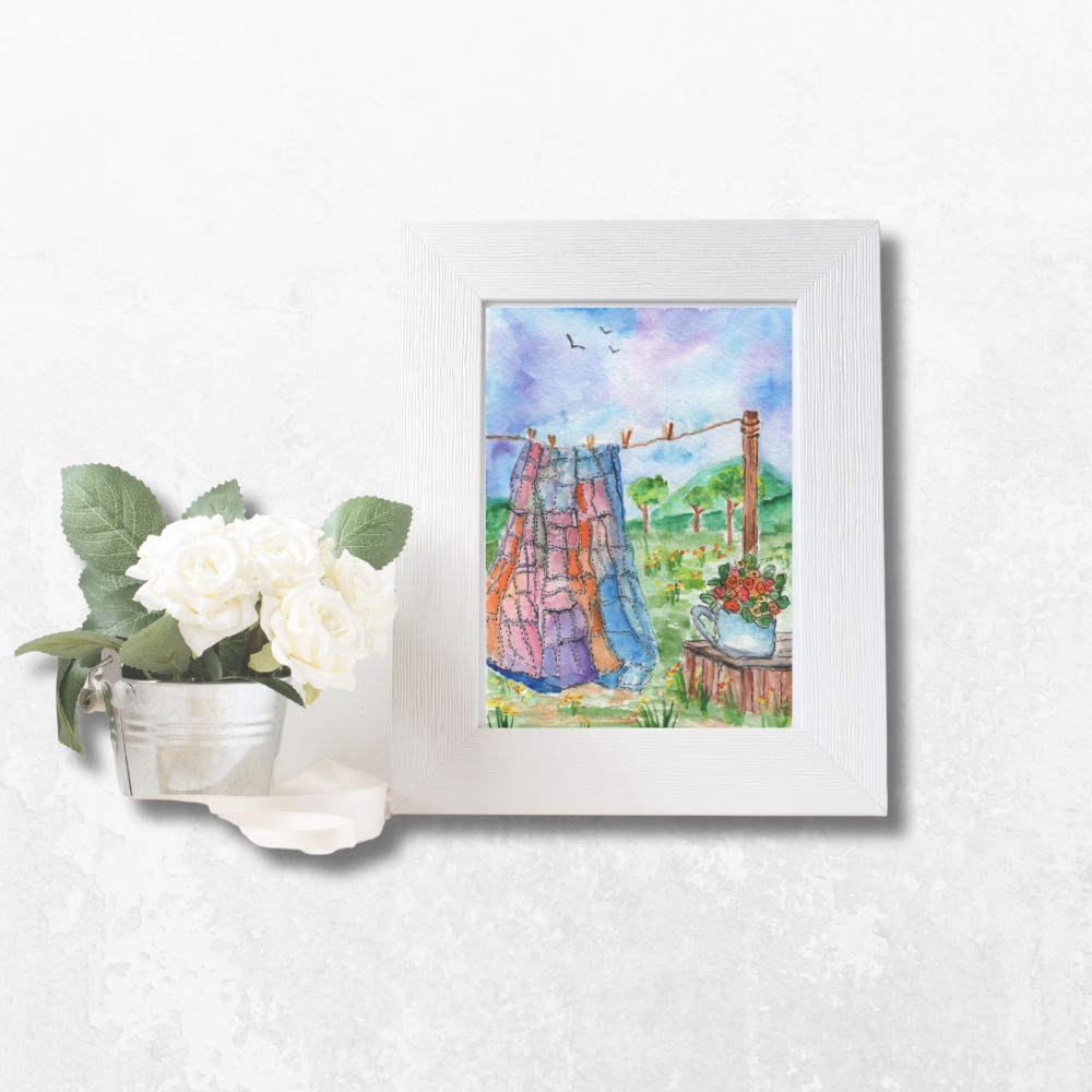 Framed 5x7 watercolor greeting card featuring quilt on clothesline and teapot with flowers