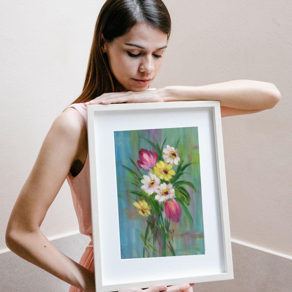 11x14 spring floral print held by woman, looking down