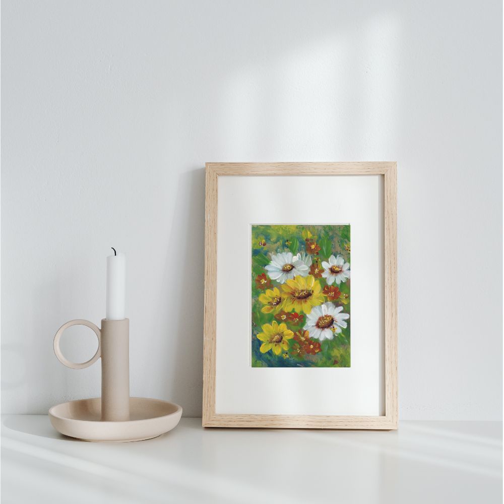 5x7 wildflower print matted to 8x10 in frame leaning against wall with white candle