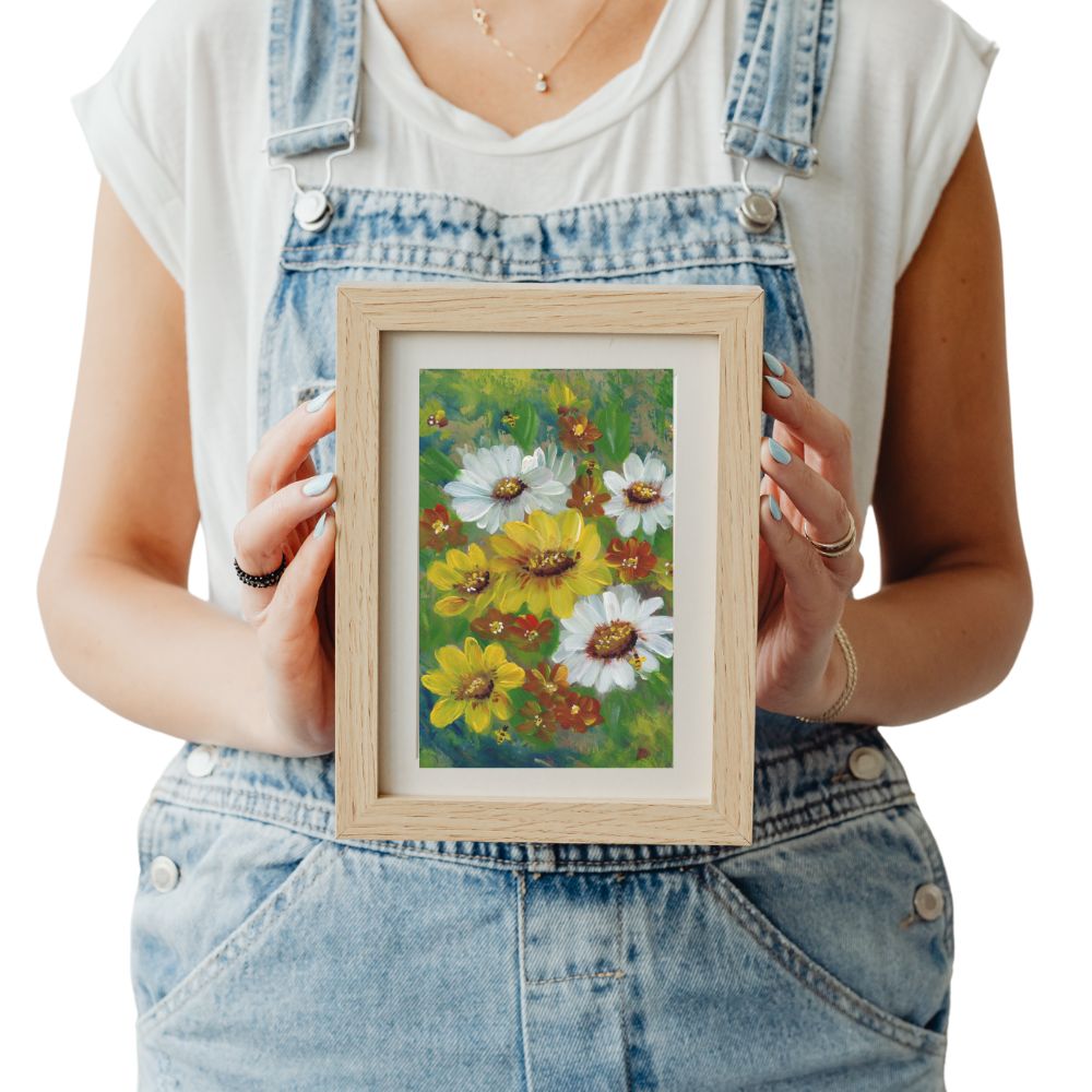 5x7 floral wildflowers print matted to 8x10 in a neutral frame held by woman