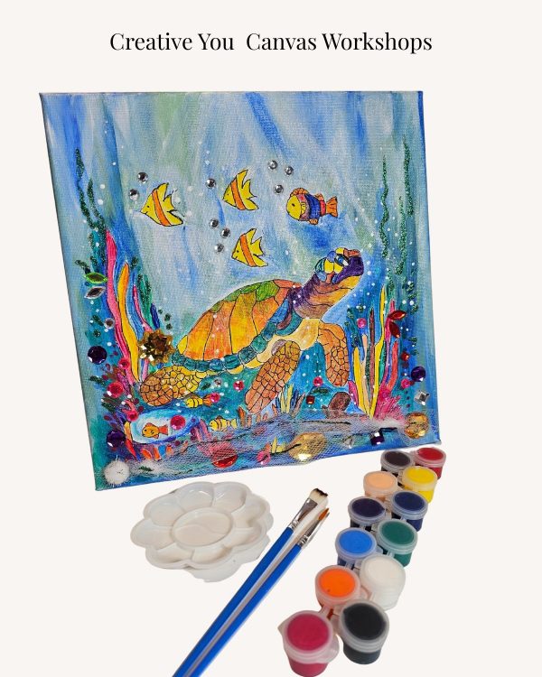 Finished Creative You acrylic canvas painting with paint pots, palette, and brushes used in a guided art workshop.