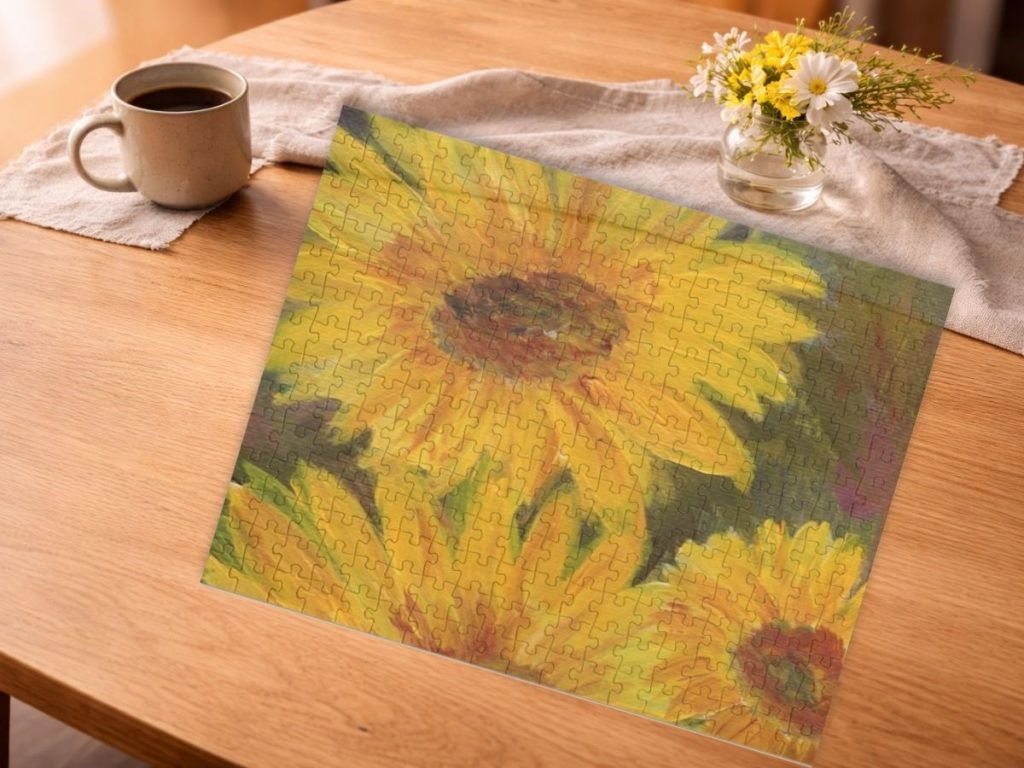Jigsaw puzzle of bright yellow sunflower painting on a warm wood table with coffee and flowers