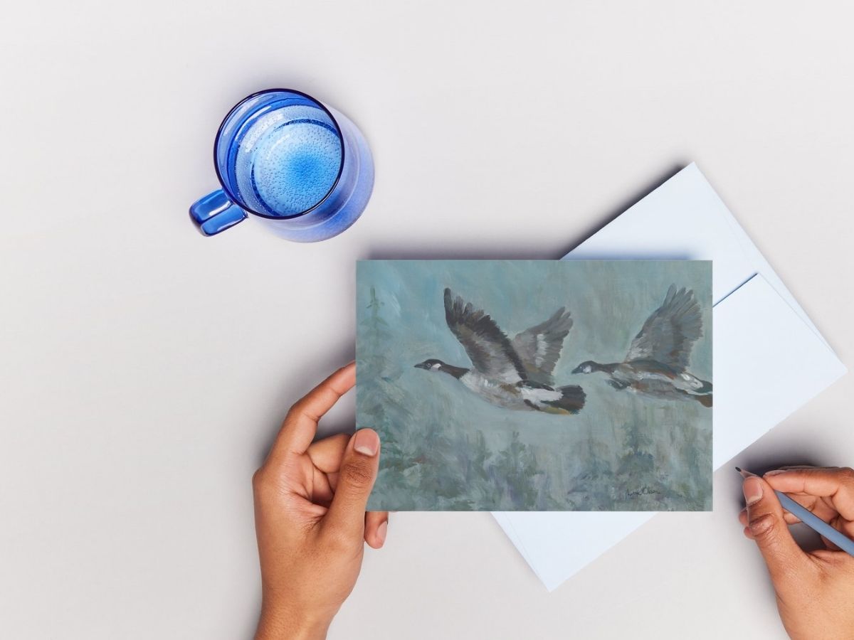 hand holding watercolor greeting card showing size reference handmade art